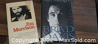 Two biography books - one of Jim Morrison and one of Brad Davis, showing their covers.