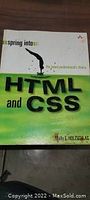 Front cover of a book titled 'Spring into HTML and CSS' showing its title and design