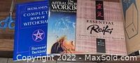 Photo showing all three books: 'Complete Book of Witchcraft', 'Astral Projection Workbook', and 'Essential Reiki'.