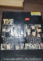 Cover of the photo book titled The Police 1978-1983 by Lynn Goldsmith showing the front cover with metallic lettering.
