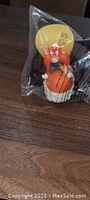 Yosemite Sam figurine dunking basketball in original plastic packaging, showing front view and toy details.