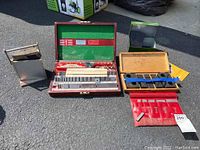 Multiple cases of machinist tools including Hoke and Starrett brands with gage blocks and borers visible