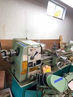 Full left-side view of Grizzly DF-1237G lathe showing headstock, bed, carriage and tailstock.