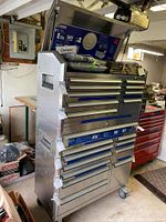 Front-left view of stacked tool chests with top lid open