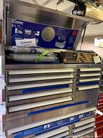 Photo of closed metal tool chest with six drawers.