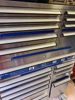 Full view of the large metal Craftsman tool chest with many drawers, closed and stacked vertically
