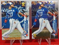 Front view of two Vladimir Guerrero Jr. baseball cards from 2020 Topps and Topps Chrome series showing player mid-swing in blue Jays uniform.