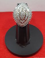 Top view of marquise-shaped diamond cluster on ring stand