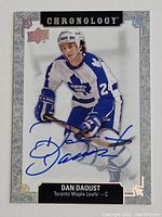 Front of an Upper Deck Chronology hockey card showing Dan Daoust in a Toronto Maple Leafs uniform, signed in blue ink.