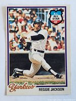 Front of 1978 Reggie Jackson New York Yankees baseball card showing player at bat in pinstripe uniform with A.L. All Star logo.