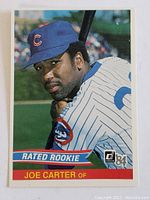 Front of the 1984 Donruss Joe Carter Rated Rookie baseball card showing Joe Carter in Chicago Cubs uniform with bat over shoulder
