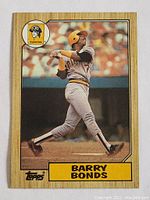 Front side of 1987 Topps Barry Bonds rookie card showing batting pose with Pirates uniform.