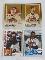 Four baseball cards including two 2020 Topps Allen & Ginter gold parallel cards and two other rookie and star Braves cards
