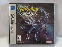 Front view of the sealed Nintendo DS Pokémon Diamond Version game case showing Dialga holographic artwork.