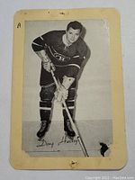 Black and white vintage Beehive hockey card featuring Doug Harvey in Canadiens uniform, front view showing player portrait and signature.