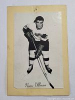 Front view of vintage 1960s Beehive hockey card showing Norm Ullman in Detroit Red Wings uniform on yellowed backing sheet.