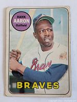 Front of the 1967 Topps Hank Aaron baseball card showing image of Hank Aaron, Braves branding and card number 100.