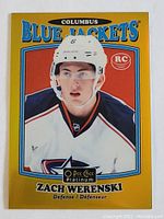Front image of Zach Werenski rookie card with Blue Jackets branding and RC logo, full color, good condition.