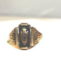 Front view showing black enamel center and shield insignia