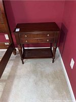 Front view of cherry-finish nightstand showing overall condition