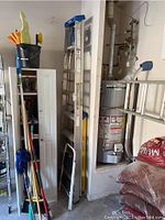 Three ladders grouped in garage