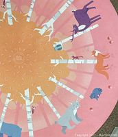 Close up photo of central part of round mat showing details of birch trees and animals including a purple deer, orange fox, raccoon and squirrels