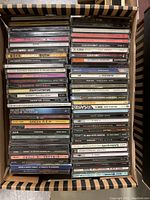 Photo of boxed lot containing 44 music CDs by various artists.
