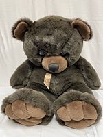 Front view of the large stuffed teddy bear showing overall condition and details.