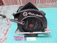 Side view of Black & Decker circular saw showing blade guard, 7-1/4 inch blade and power cord.