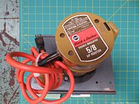 Top view of Black & Decker 5/8 HP router with power cord coiled around the base.