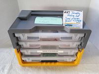 Black and yellow plastic four-drawer storage organizer with clear drawers labeled 'semi-precious beads'.