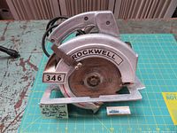 Full view of Rockwell circular saw showing overall condition and size on cutting mat.