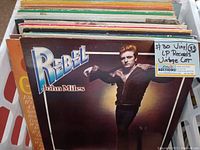 Image showing top album 'Rebel' by John Miles in a box of vinyl albums.