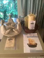 Photo of the candle holder and the tabletop fountain showing the full items on a table with instruction manual and price tag.