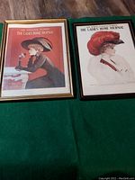 Two framed Ladies Home Journal covers from 1907 and 1915 shown side by side on a green cloth surface.