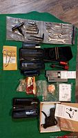 Wrenches and Allen key sets laid out on green cloth