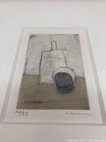 Close-up photo of the abstract geometric etching showing artist signature and numbering (10/25).