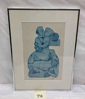 Full view of framed abstract lithograph showing a couple kissing, predominantly blue shades, signed by artist.