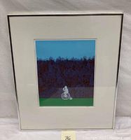 Framed lithograph showing a young girl riding a high-wheel bicycle in front of a tree line with sky background.