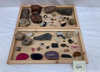 Full overview of all mineral rocks and fossils on wooden trays, various sizes and colors
