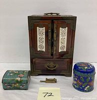 Wooden Chinese vanity/jewelry box, two cloisonné trinket boxes, small brass lock and key displayed together