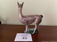 Front view of Royal Doulton llama figurine showing full body, glaze, and facial detail.