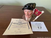 Full view of Toby Jug with accompanying certificate and lot card