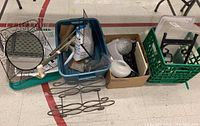 Photo showing assortment including the boot scraper, mirror, plastic bins, light shades, grout bag, and hardware pieces.
