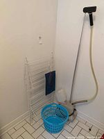 Full lot including Jiffy Pro Line steamer, white clothes drying rack, blue laundry basket, and clothes pin holder.