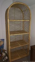 Frontal view of entire wicker shelf unit