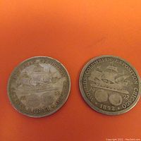 Both 1892 and 1893 Columbian Exposition Half Dollar coins showing the ship side with date and exposition text