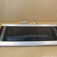 Front view of unit showing full panel and antenna