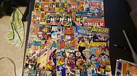 Overview of 26 assorted Marvel comic books featuring Avengers, Fantastic Four, and The Incredible Hulk.