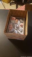 Box with Marvel Now! Point One comic visible on top of stack inside the box.